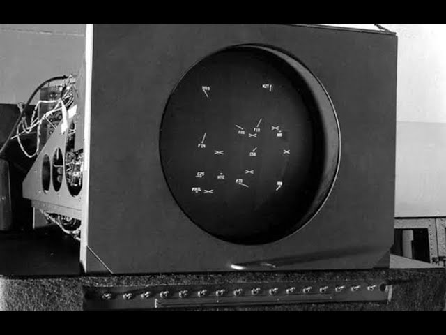 A cathode ray tube monitor displays white dots on a black background.